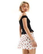 ditsy rose print tiered mini skirt in white