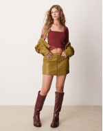 mesh angel sve top with lettuce hem detail in fig